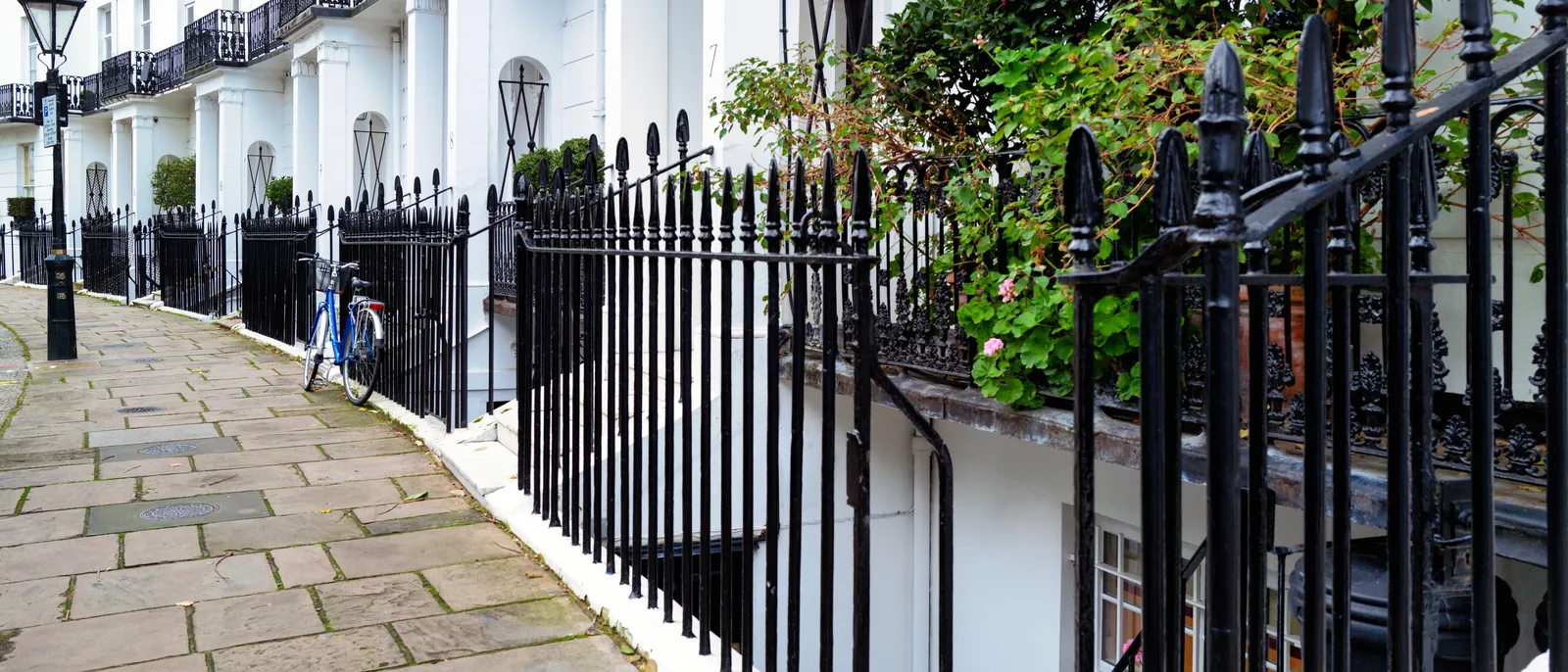 White stucco terrace with painted railings in Belgravia, London SW1 — The Finishing House