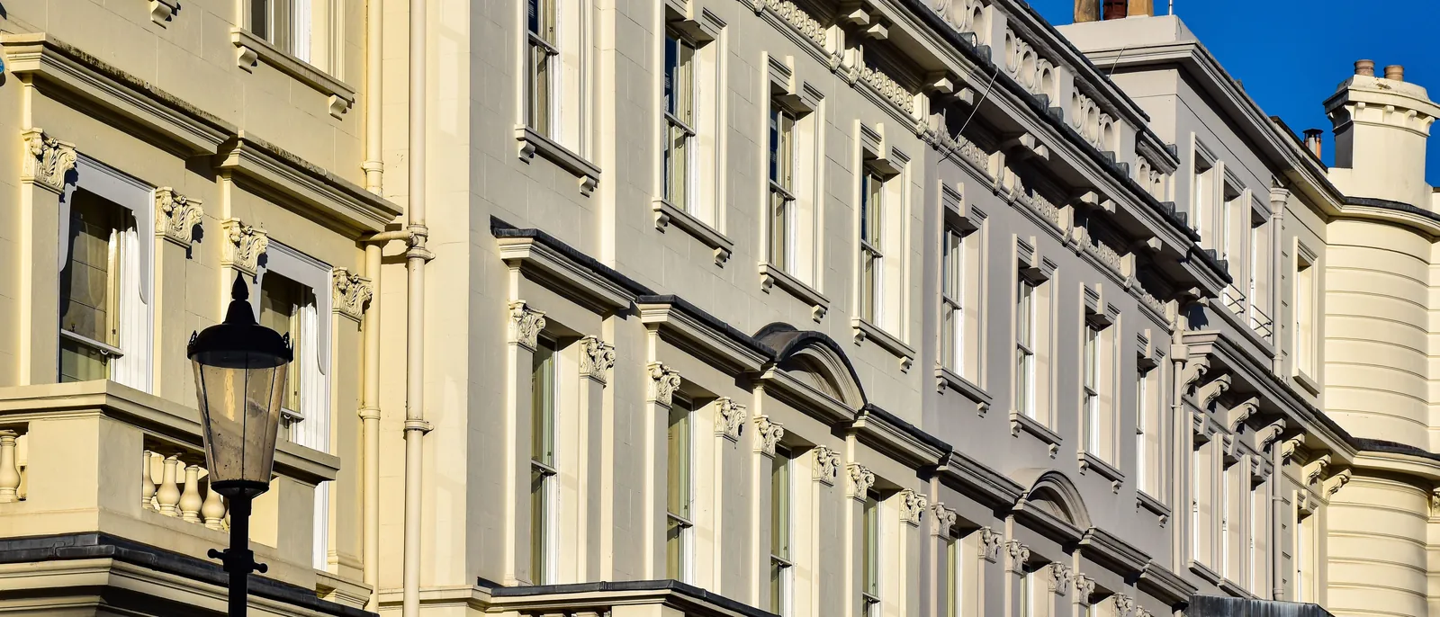 Stucco-fronted townhouses in Kensington, London W8 — The Finishing House