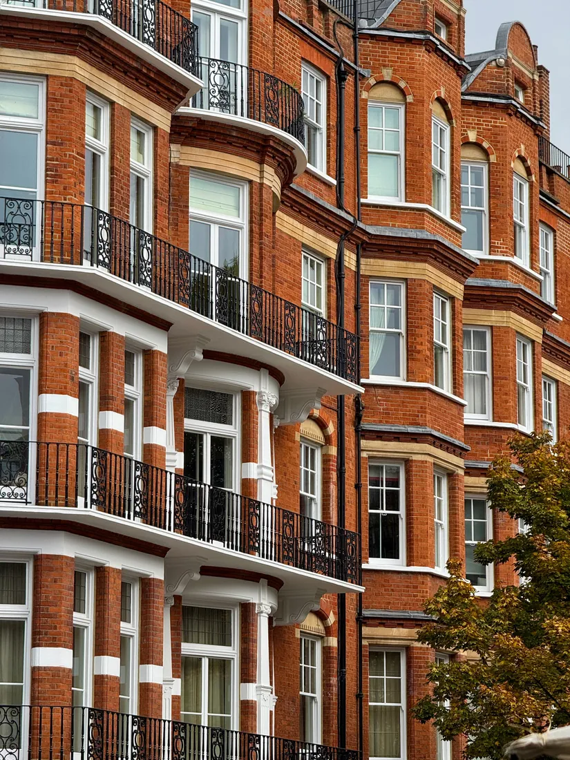 Red brick period mansion with iron balconies, Kensington, London