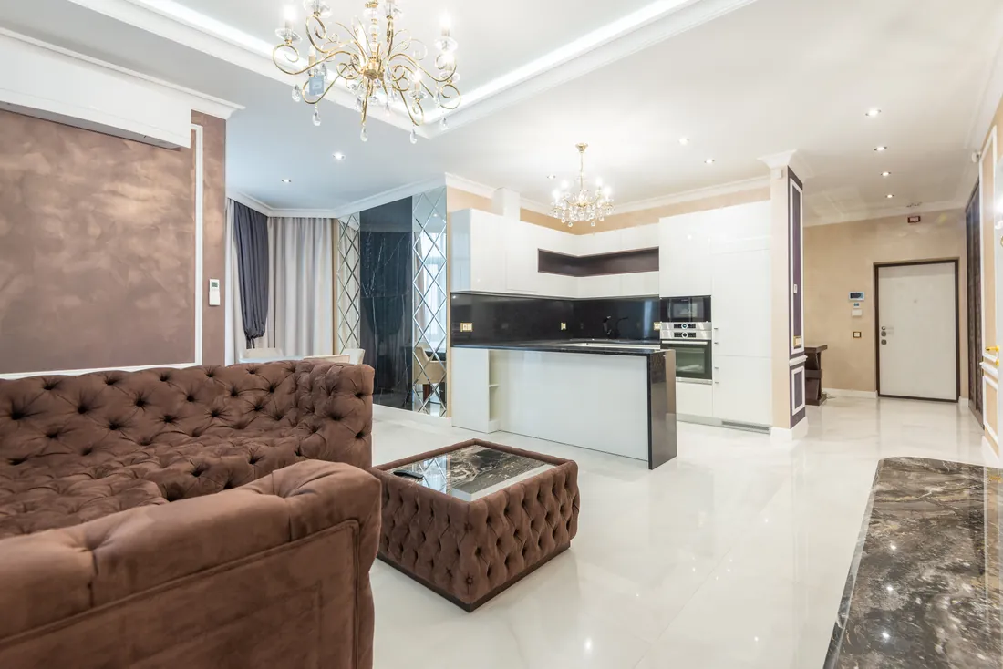 Open-plan luxury apartment interior in soft neutral tones, London