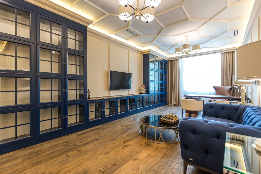 Blue panelled living room in a luxury apartment, London