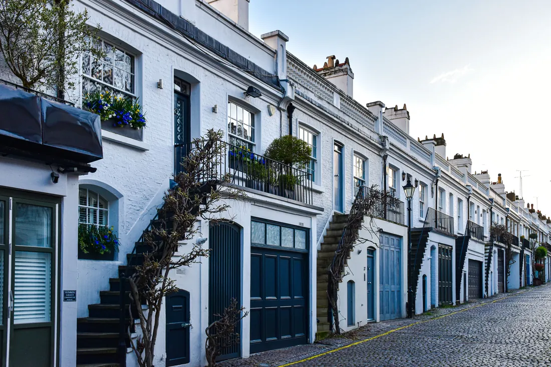 Painted blue garage doors on a cobbled London mews
