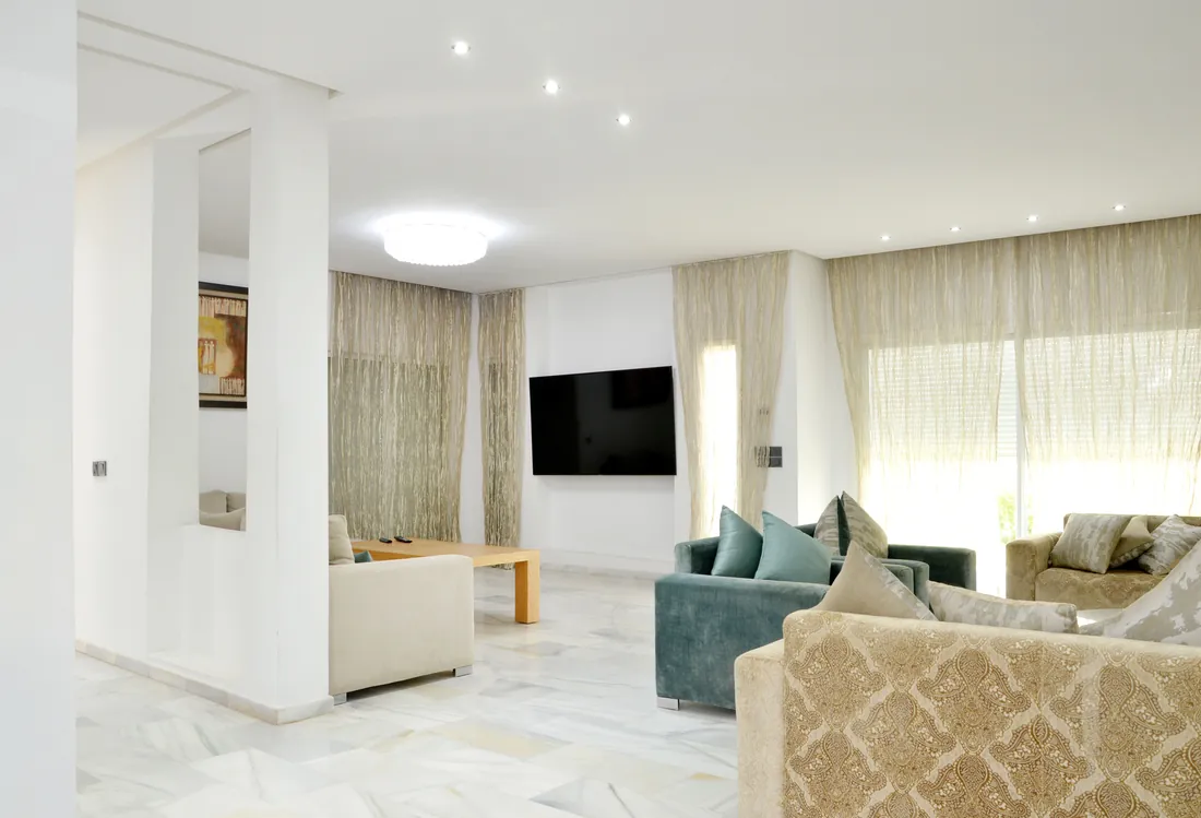 Spacious modern living room with a large sofa, London