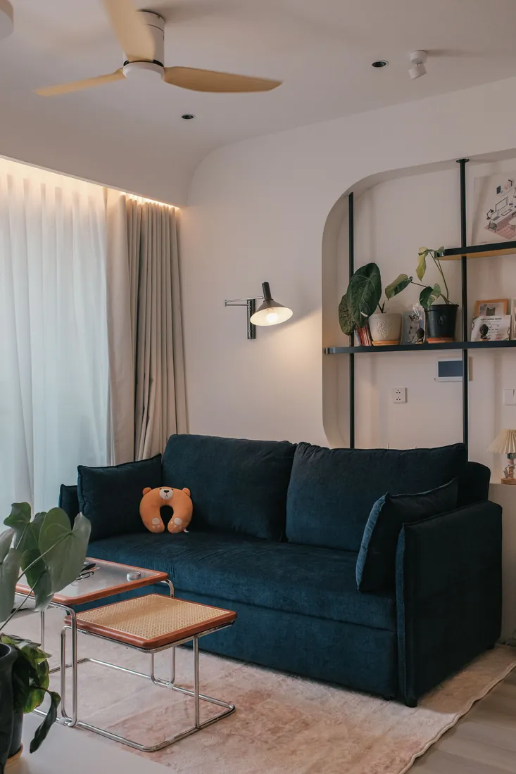 Premium living room with a navy sofa and painted walls, London