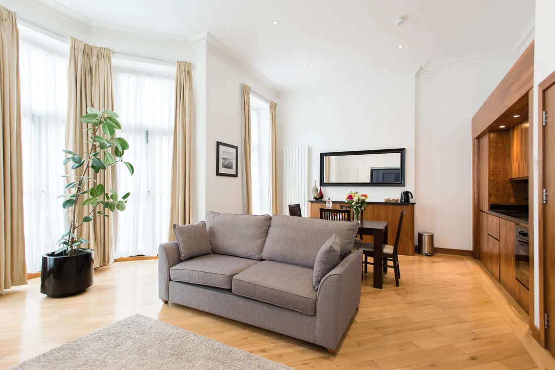 Bright Kensington reception room painted in soft neutrals by The Finishing House