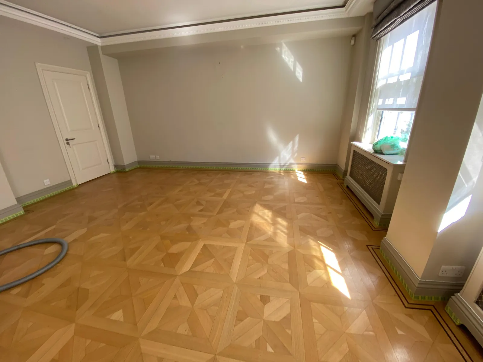 Drawing room in a period apartment, walls and woodwork finished, Mayfair