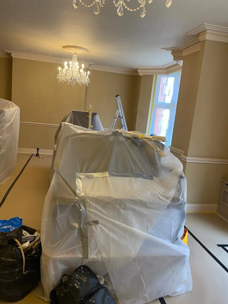 Living room furniture wrapped, floor sheeted, Mayfair