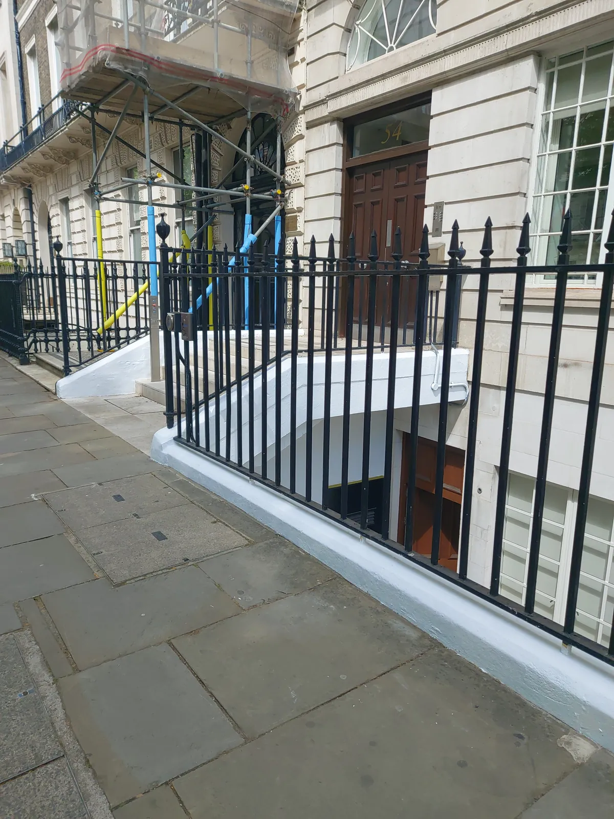 Plinth wall and railings repainted, Marylebone