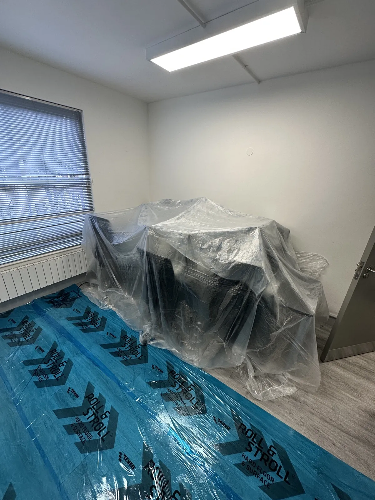 Office floor protected, desks wrapped, Mayfair