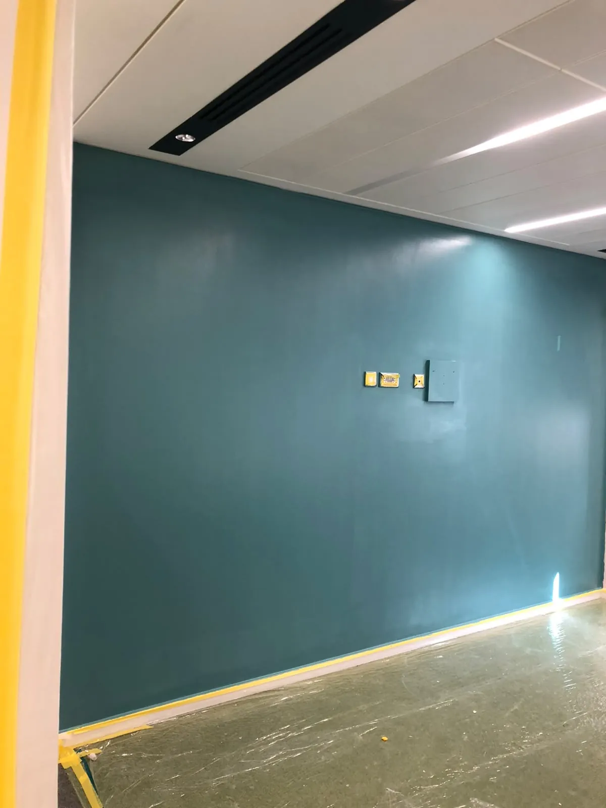 Office feature wall in teal, Central London