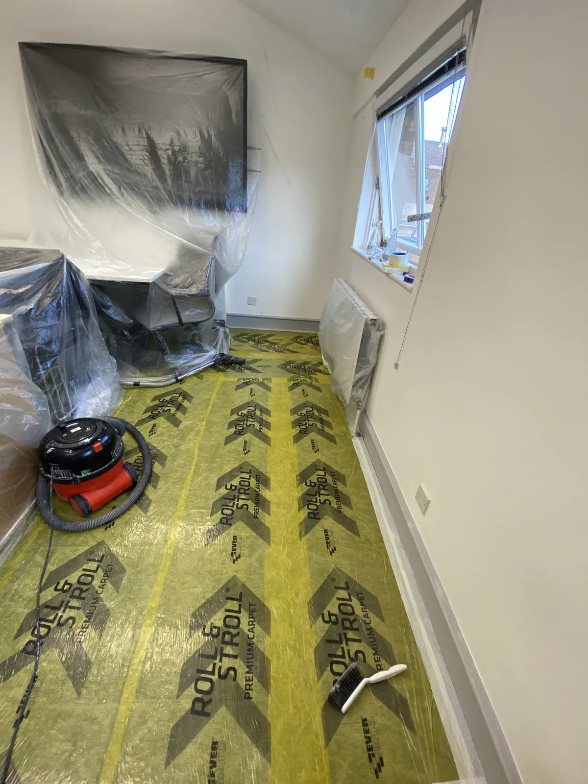 Office floor sheeted before painting, Mayfair