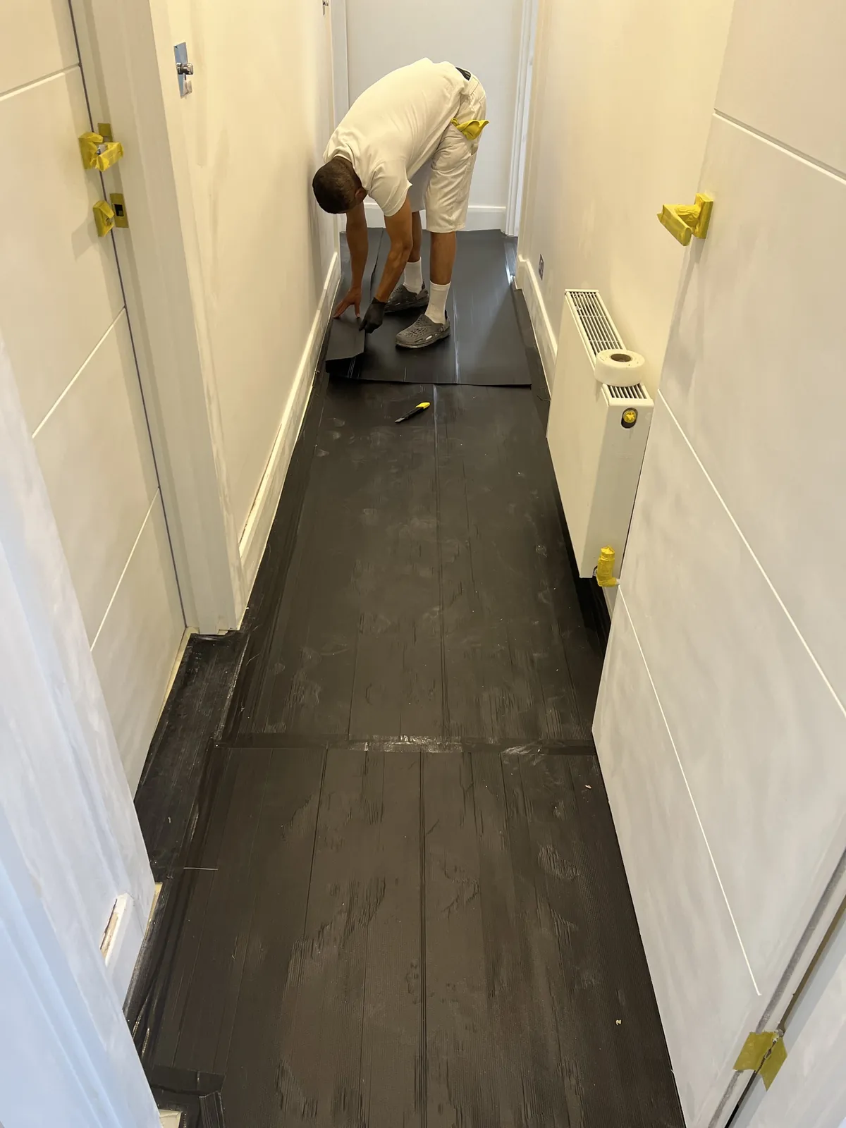 Floor protection being laid, St John's Wood