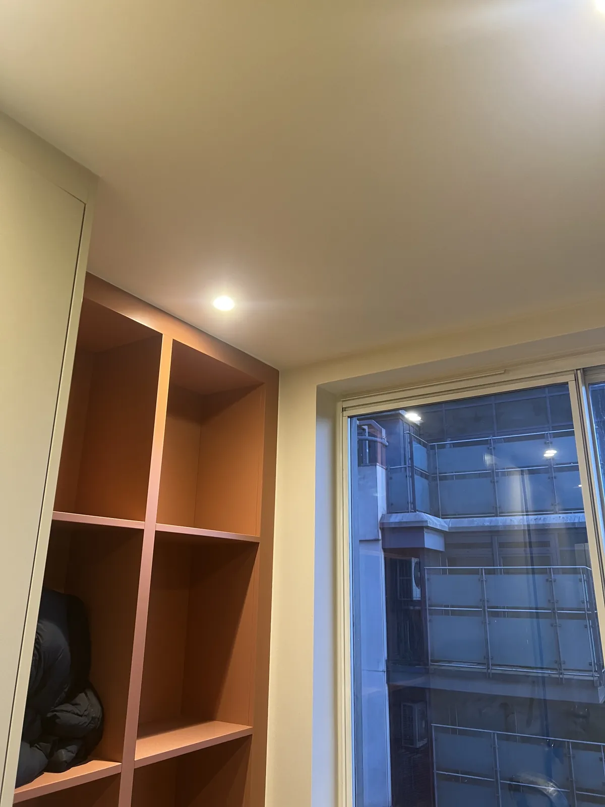 Terracotta shelving, walls finished, St John's Wood