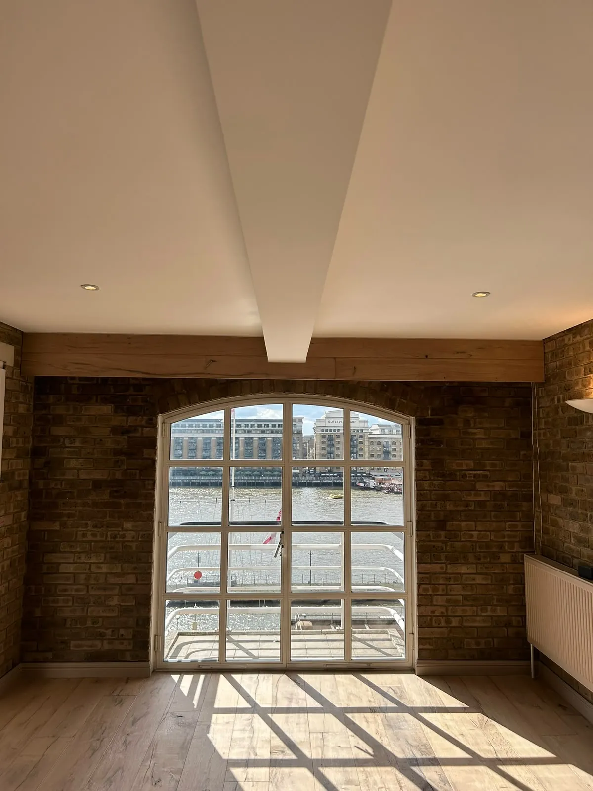 Warehouse conversion, walls beside brick, London