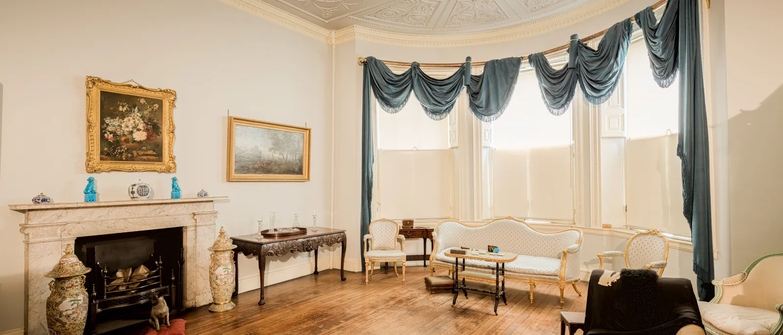 Period drawing room with bay window and restored joinery in a London townhouse by The Finishing House