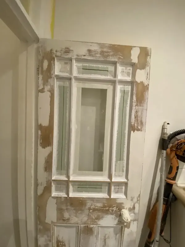 Panelled door stripped back to bare timber, Kensington