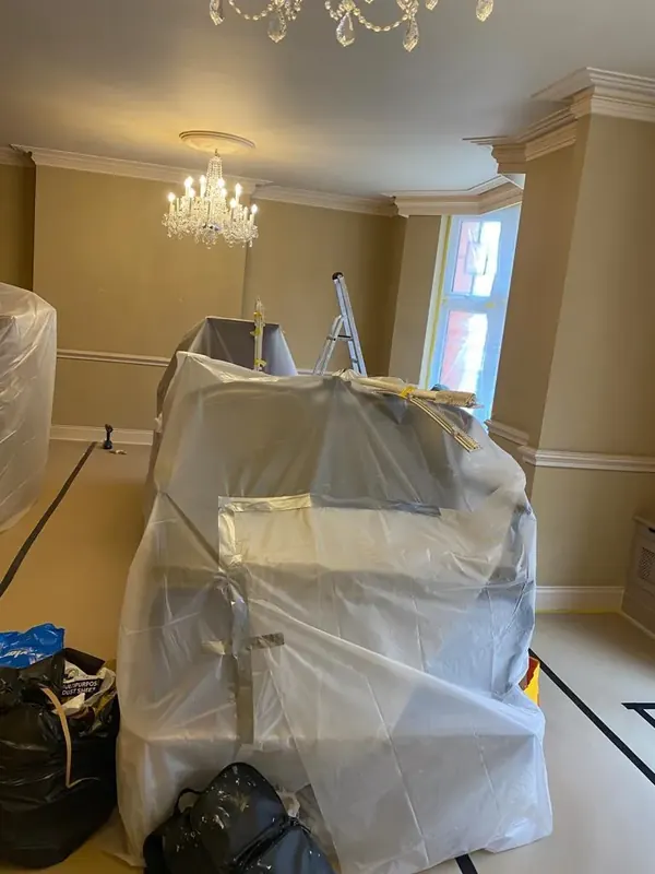 Living room furniture wrapped, floor sheeted, Mayfair