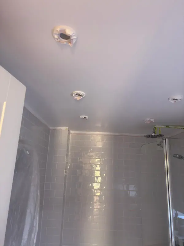 Bathroom ceiling masked before painting, Marylebone